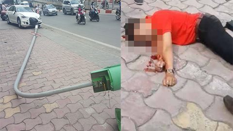 Audi húc đổ cột đèn trúng người đi bộ trên phố Hà Nội