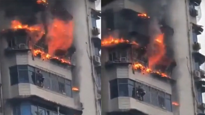 Phút sinh tử đu mình trên ban công cao tầng cháy ngùn ngụt